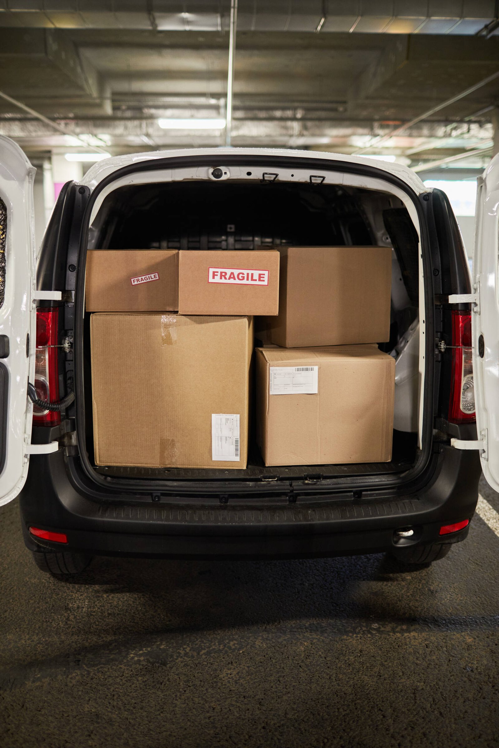 Vertical background image of delivery van or moving van filled with boxes, copy space